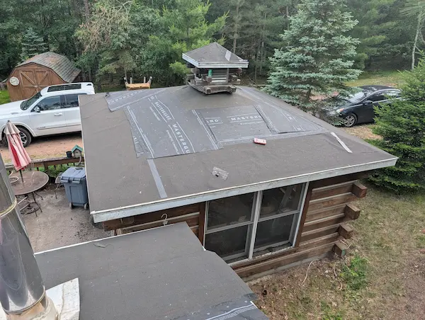 Low-slope roof replacement with new roofing underlayment