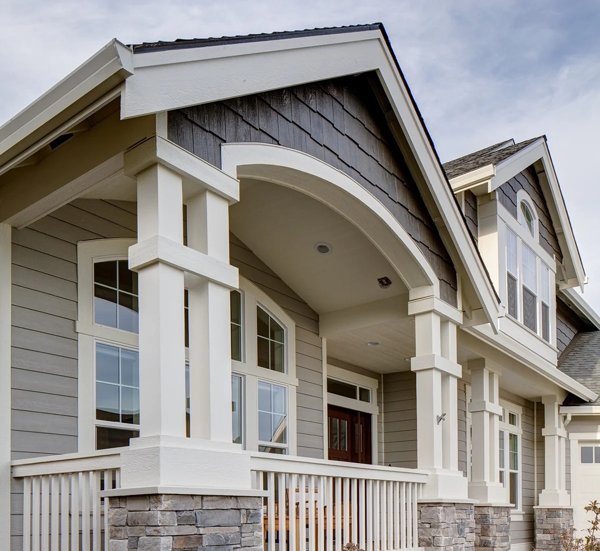 Premium siding installation on a luxury home exterior